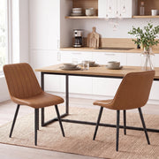 Brown faux leather dining chairs paired with a dining table in a modern kitchen