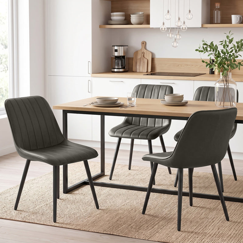 Grey faux leather dining chairs paired with a dining table in a modern kitchen