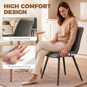 Close-up of the grey chair's curved backrest and thick foam seat padding