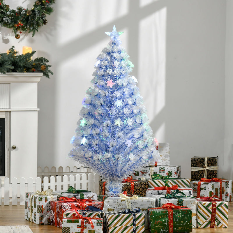4ft white and blue Christmas tree surrounded by wrapped gifts in front of a fireplace