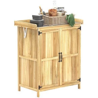 Small wooden garden shed with stainless steel worktop styled with a wicker basket and pots