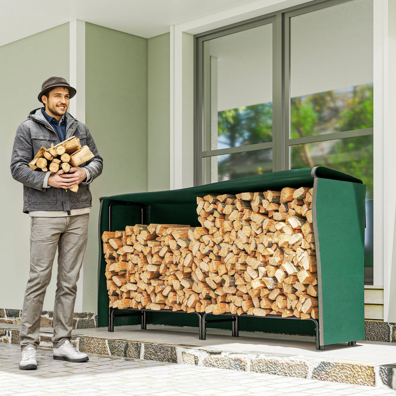 Man carrying firewood beside a full Outsunny log rack with waterproof cover on a patio