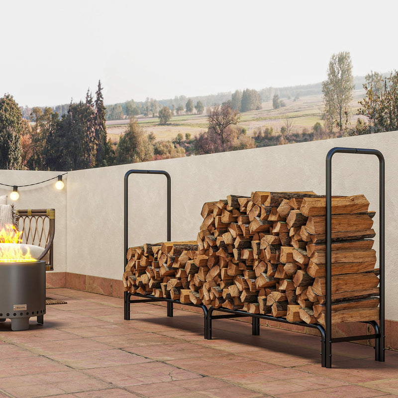 Firewood rack fully stacked with logs on a patio next to a lit fire pit
