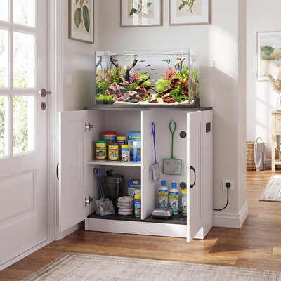 Fish tank stand styled with an aquarium on top and supplies inside the open cabinet