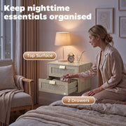 Woman opening the lower drawer of the oak unit, top surface and 2 drawers labelled
