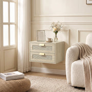 Single oak rattan bedside table mounted beside a cream armchair by a window