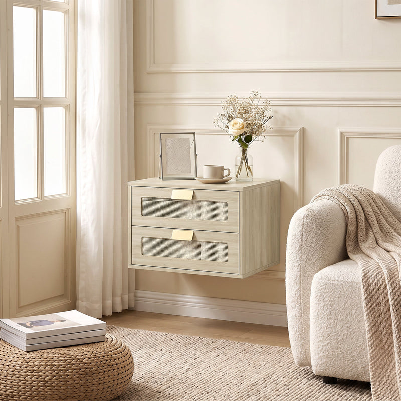 Single oak rattan bedside table mounted beside a cream armchair by a window