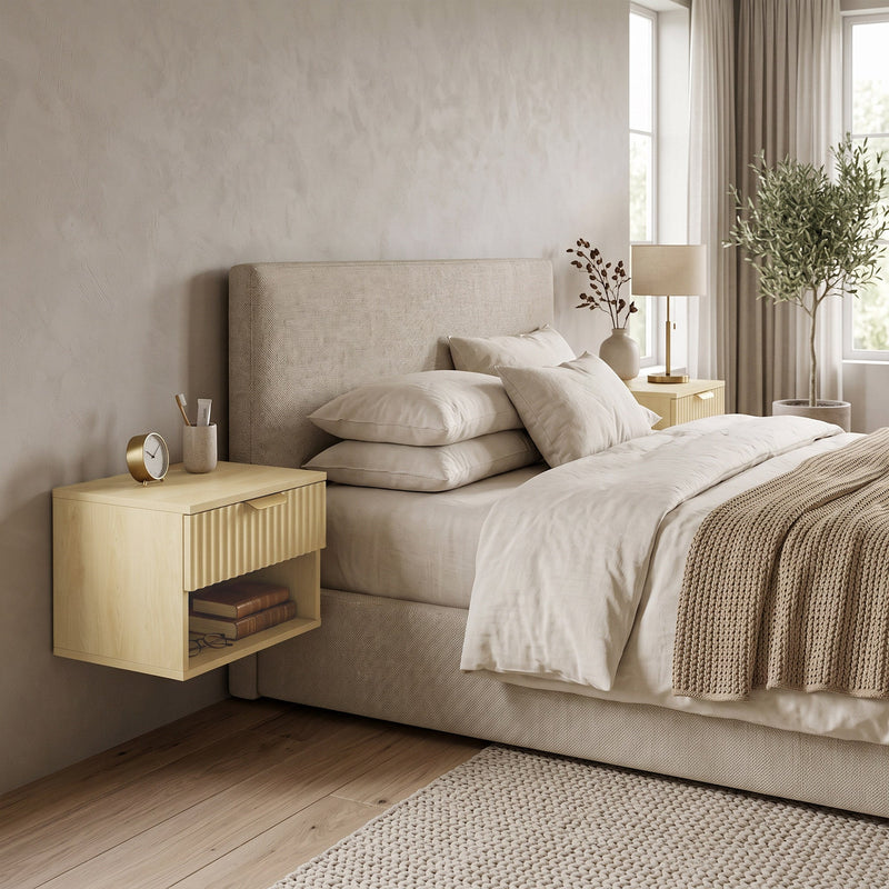 Single oak floating nightstand beside an upholstered bed