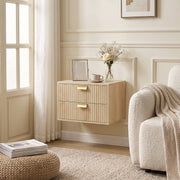 Single oak nightstand mounted beside a cream armchair near a window