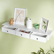 Songmics floating wall shelf with 3 drawers in white, drawers closed