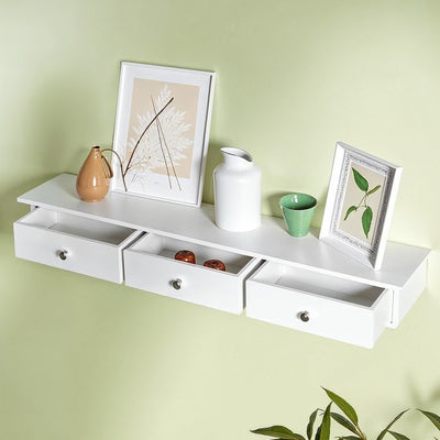 Songmics floating wall shelf with 3 drawers in white, drawers closed