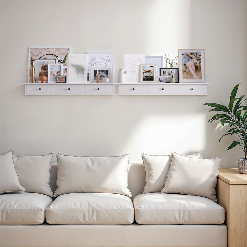 Songmics white floating shelf mounted in a living room above a sofa