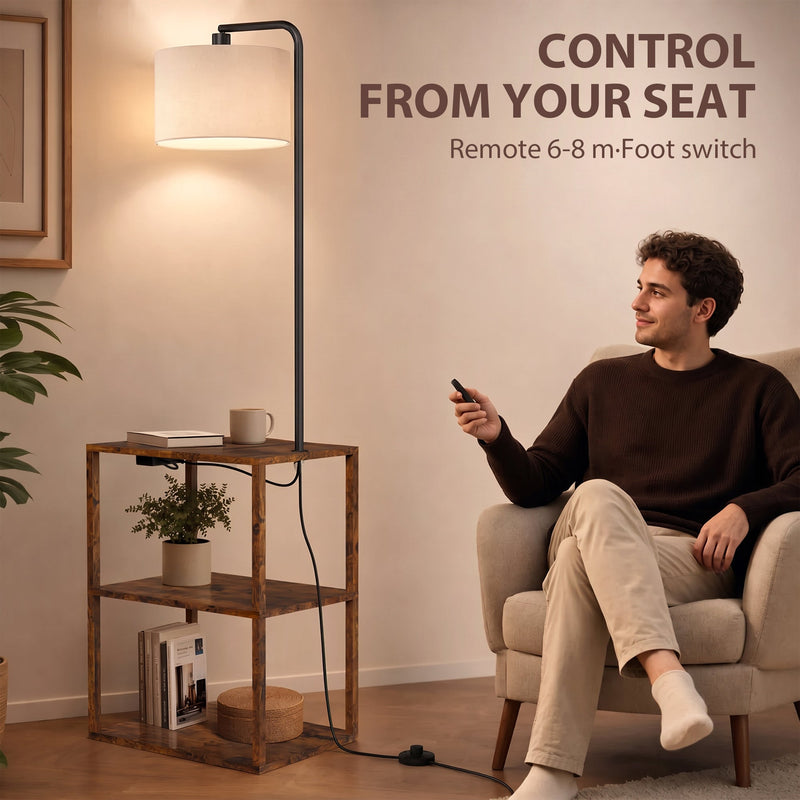 Man in an armchair using the remote beside the rustic brown floor lamp with shelves