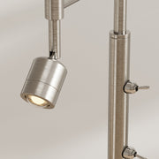 Close-up of the adjustable reading light head and switches on the silver pole