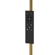 Close-up of the magnetic remote control mounted on the gold lamp pole