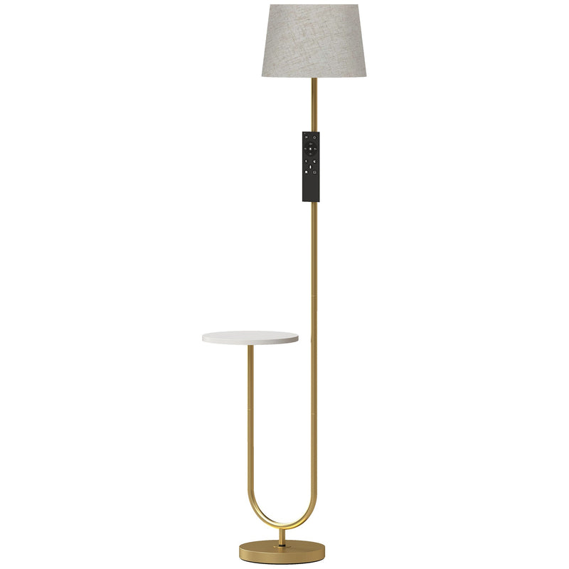 Gold floor lamp with linen shade and round white shelf on a white background