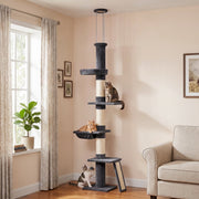 Cat tree in a living room corner with cats on the perches
