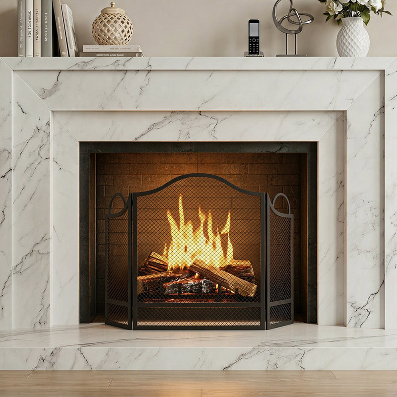 Fireplace screen standing in front of a lit marble fireplace
