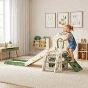 Toddler climbing the ladder on the cream slide set in a playroom with picture frames