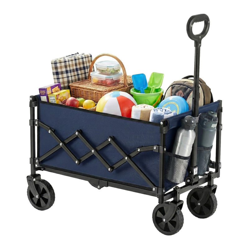 Trolley loaded with a picnic blanket, wicker basket, beach ball, towels and a rucksack