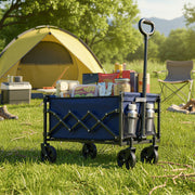 Trolley filled with food and drinks on grass in front of a yellow tent and a camping chair