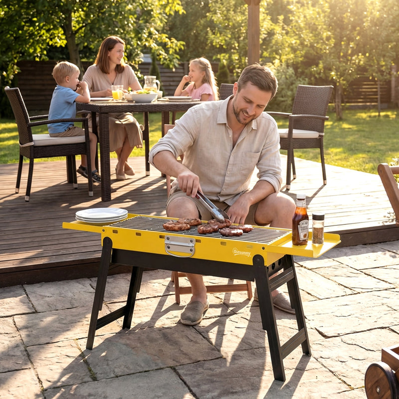Yellow Outsunny BBQ grill in use on a patio deck with a family having dinner