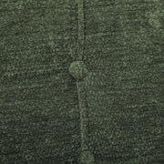 Close-up of a button and stitching on the light green chenille seat