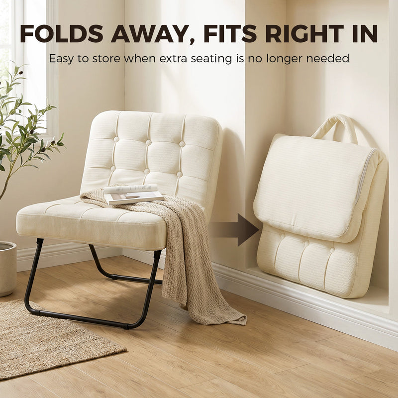 Cream white accent chair open beside a window and folded flat against the wall