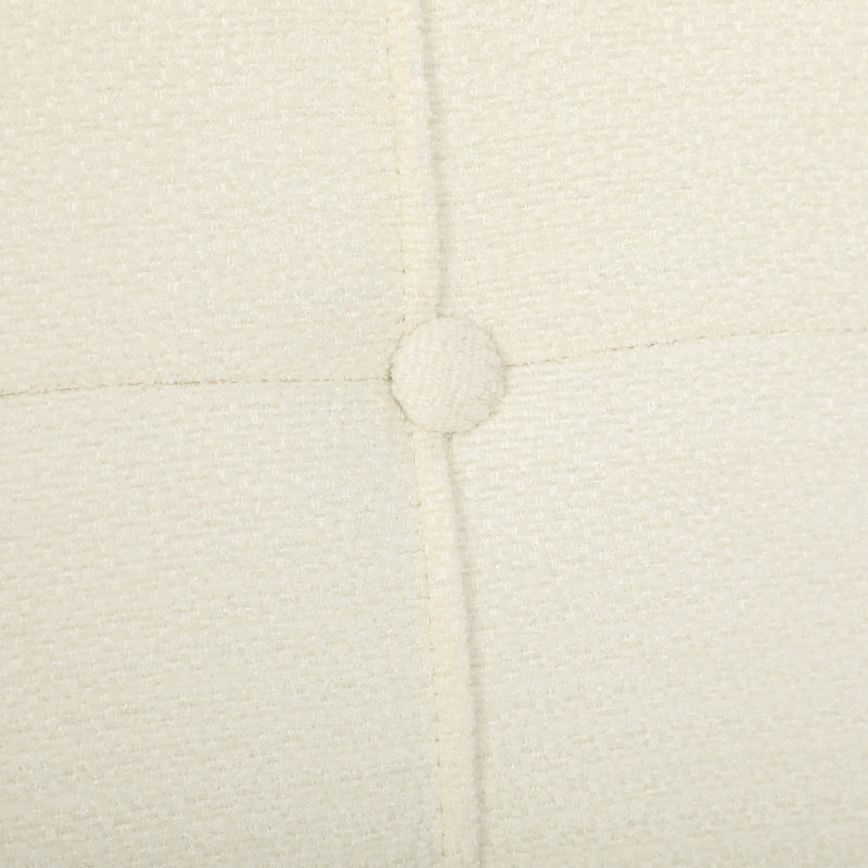 Close-up of a button and stitching on the cream white chenille seat