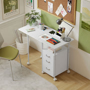 White foldable desk set up as a craft and study desk with pencils, a lamp and a pinboard