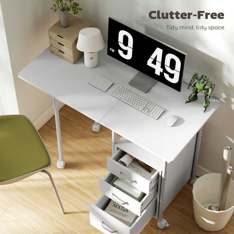 White desk opened with a monitor, keyboard and an open drawer holding books, with a clutter-free caption