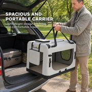 Man lifting the pet carrier by its top handles beside an open car boot