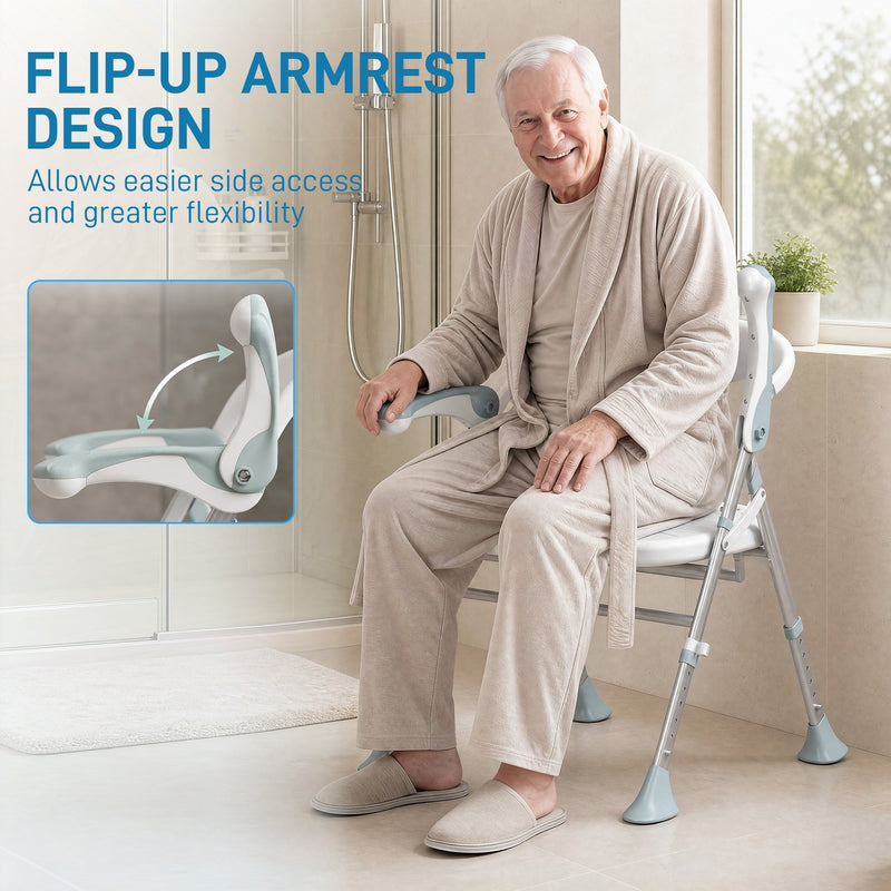 Older man in a dressing gown sitting on the shower chair using the flip-up armrest for support