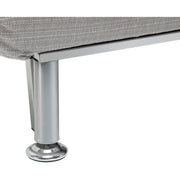 Close-up of adjustable metal foot pad on chair bed leg