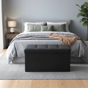 Songmics ottoman used as a footstool in a living room