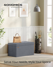 Songmics storage ottoman with lid open showing interior storage space, slate grey