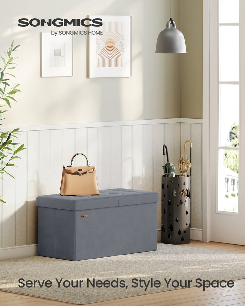 Songmics storage ottoman with lid open showing interior storage space, slate grey