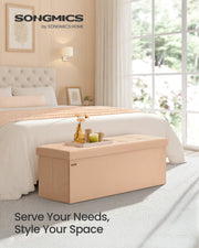 Ottoman shown open revealing internal storage with divider
