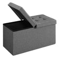 Dark grey storage ottoman with one half of the split lid flipped open to show the interior