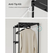 Anti-tip wall strap fixed to the frame, with the assembled wardrobe and a hanging garment