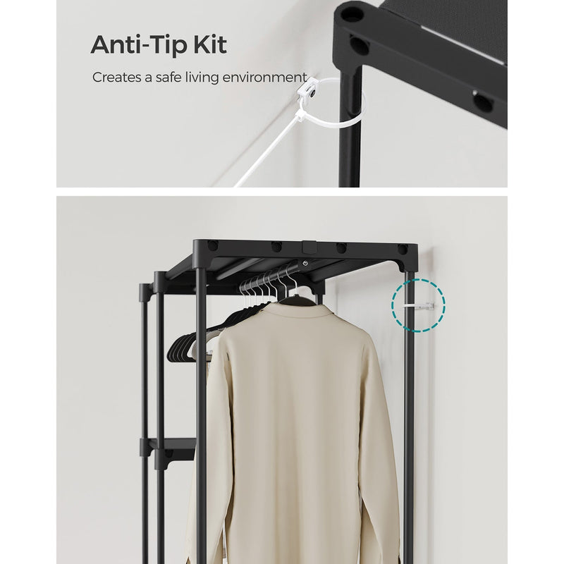 Anti-tip wall strap fixed to the frame, with the assembled wardrobe and a hanging garment