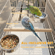Two budgies on the wooden perch beside the two stainless steel food bowls