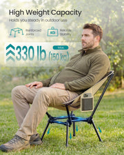 Man seated in the khaki camping chair showing its 150 kg weight capacity