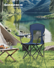 Harbour blue Songmics camping chair on grass by a lake with a tent behind