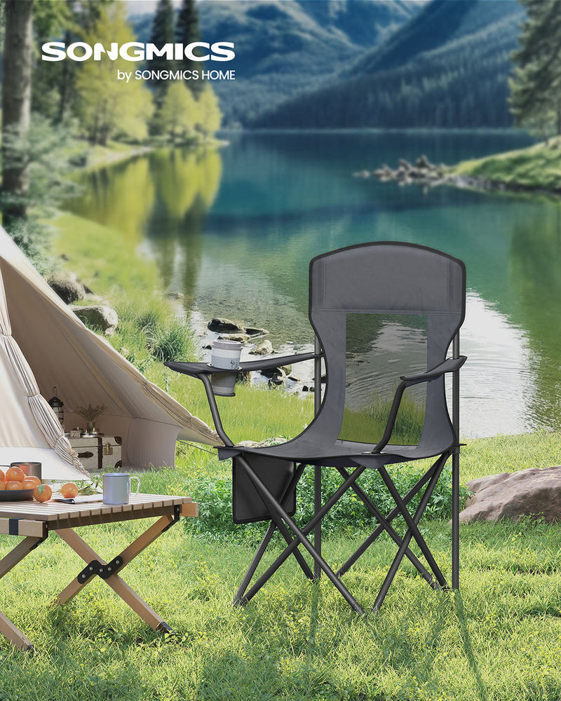 Slate grey Songmics camping chair pitched on grass beside a lake and tent
