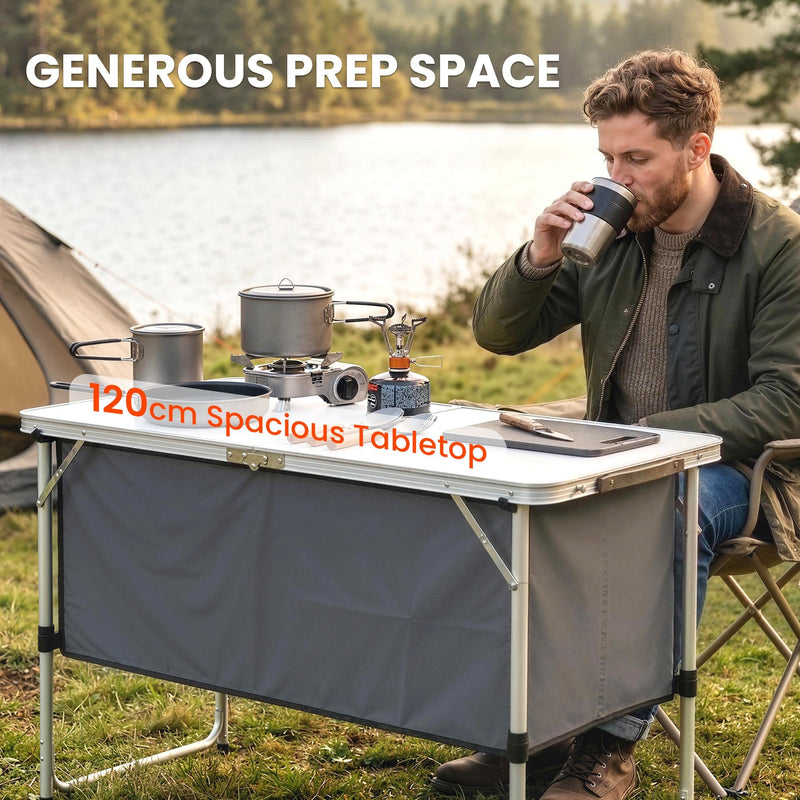 Man drinking coffee beside a lake at the 120cm camping table worktop