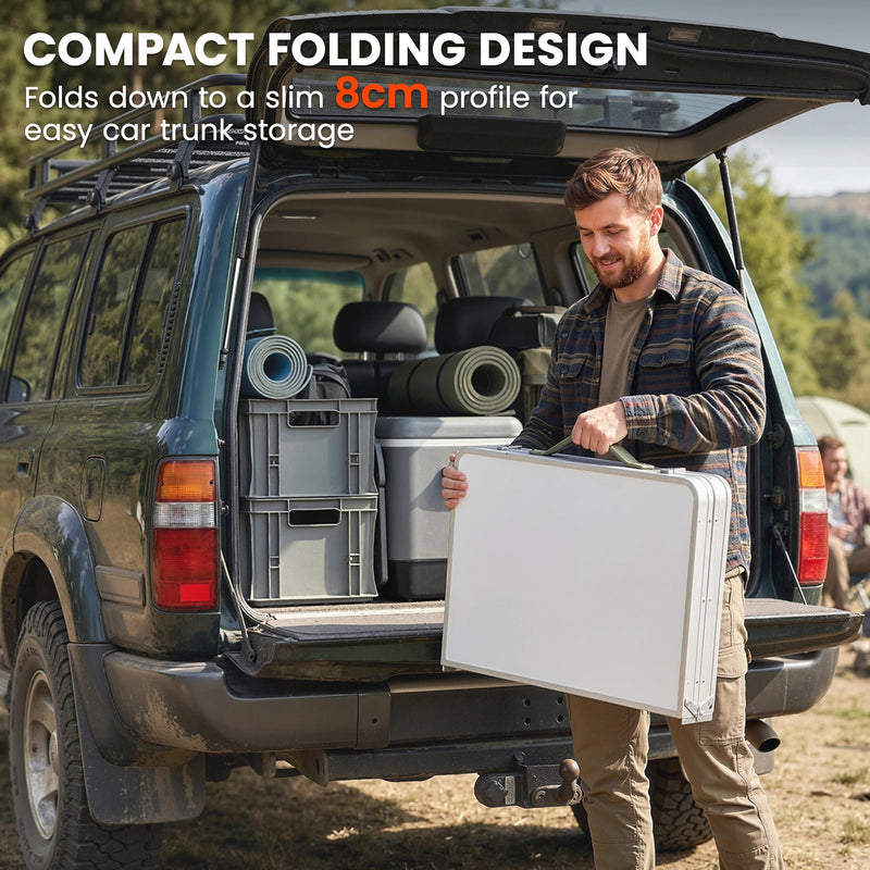 Man loading the folded table into a car boot, compact folding design callout