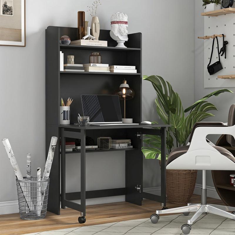 Black folding desk opened out in a home office with a laptop on the tabletop, books on the shelves and a white office chair alongside