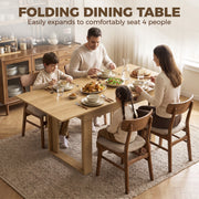 Family of four eating dinner at the expanded oak effect folding dining table