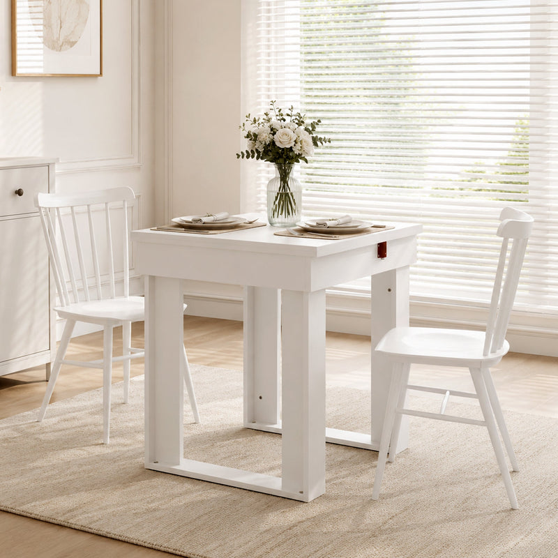 Table folded to its compact square size set for two people by a window